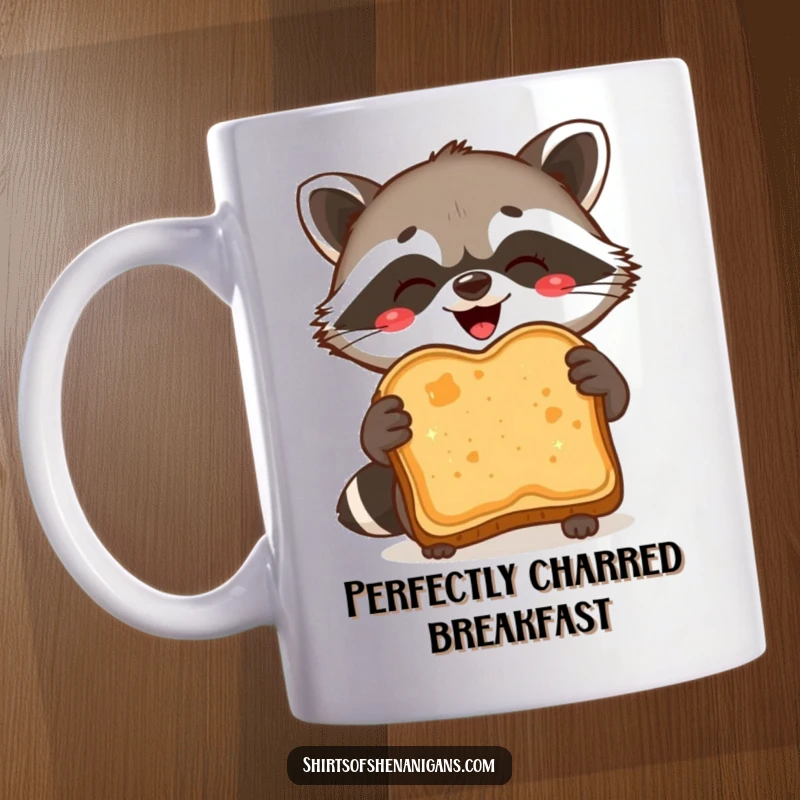 Funny Mug: A delighted raccoon proudly holds a burnt slice of toast, showcasing culinary mishaps.