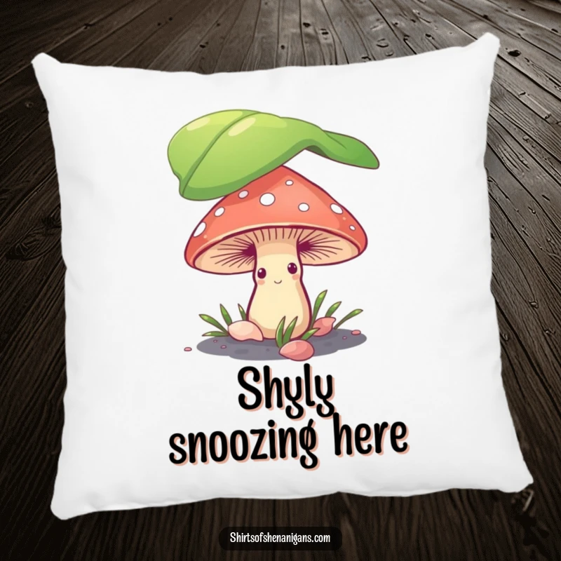 Funny shy mushroom hiding under a leaf, depicted on a plush decorative pillow for a touch of whimsical humor.