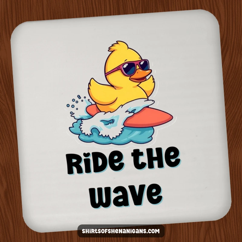 Funny drink coaster featuring a rubber duck wearing sunglasses surfing a wave, protecting surfaces with beachy charm.