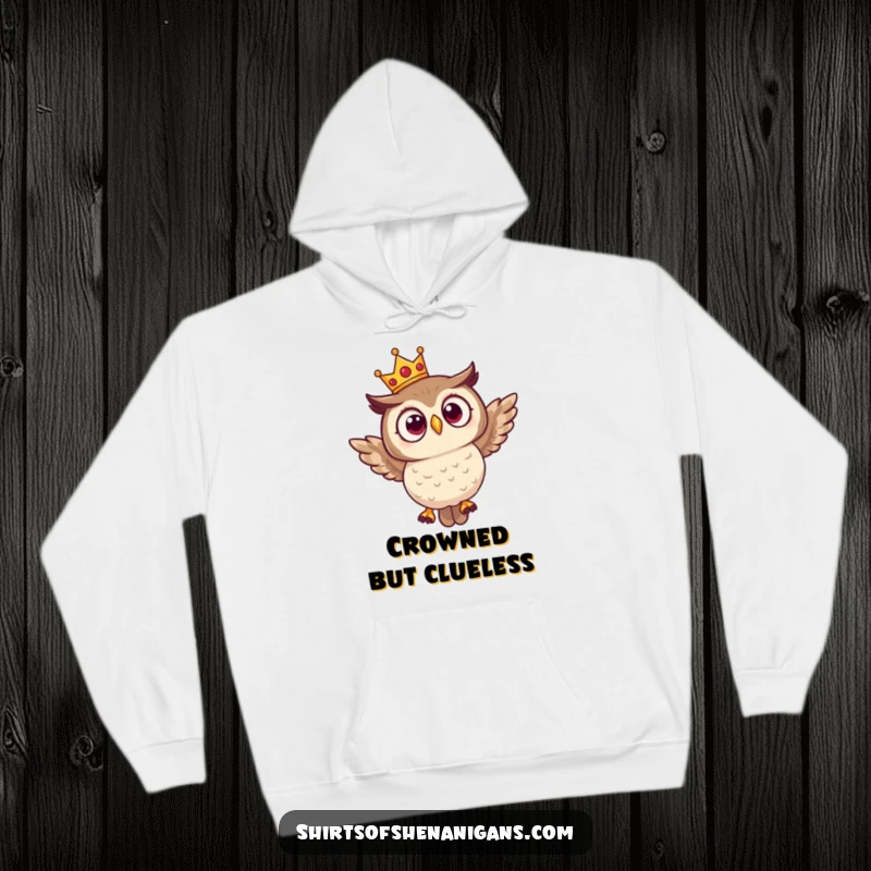 Funny hoodie showcasing a surprised owl adorned with a tiny crown, comically attempting to fly, radiating humorous bewilderment.