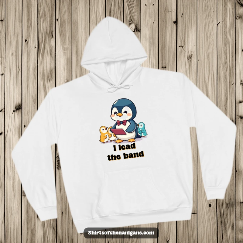 Funny hoodie featuring a penguin in a bowtie, energetically conducting an orchestra of squeaking sounds.