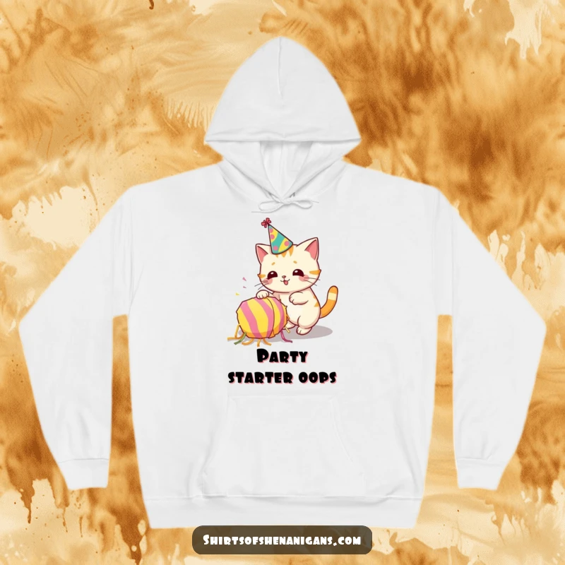 Funny hoodie depicting a cat wearing a party hat and accidentally knocking over a piñata, festive fun.