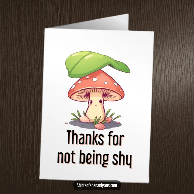 Funny Free Printable Thank You Card: a shy mushroom peeking from under a leaf expressing thanks humorously.
