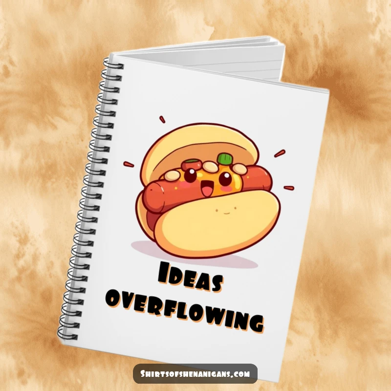 Funny notebook cover showing a surprised hot dog bun bursting with condiments, a whimsical stationery item.