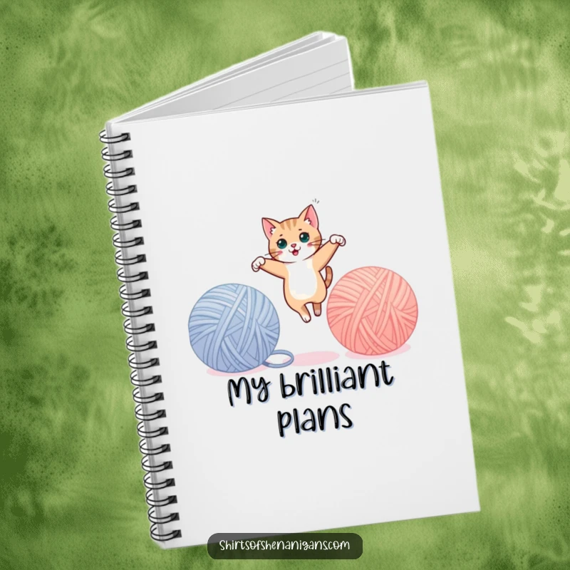 Funny cat notebook cover, mid-leap between yarn balls, ready for notes and playful ideas. A cute funny gift.