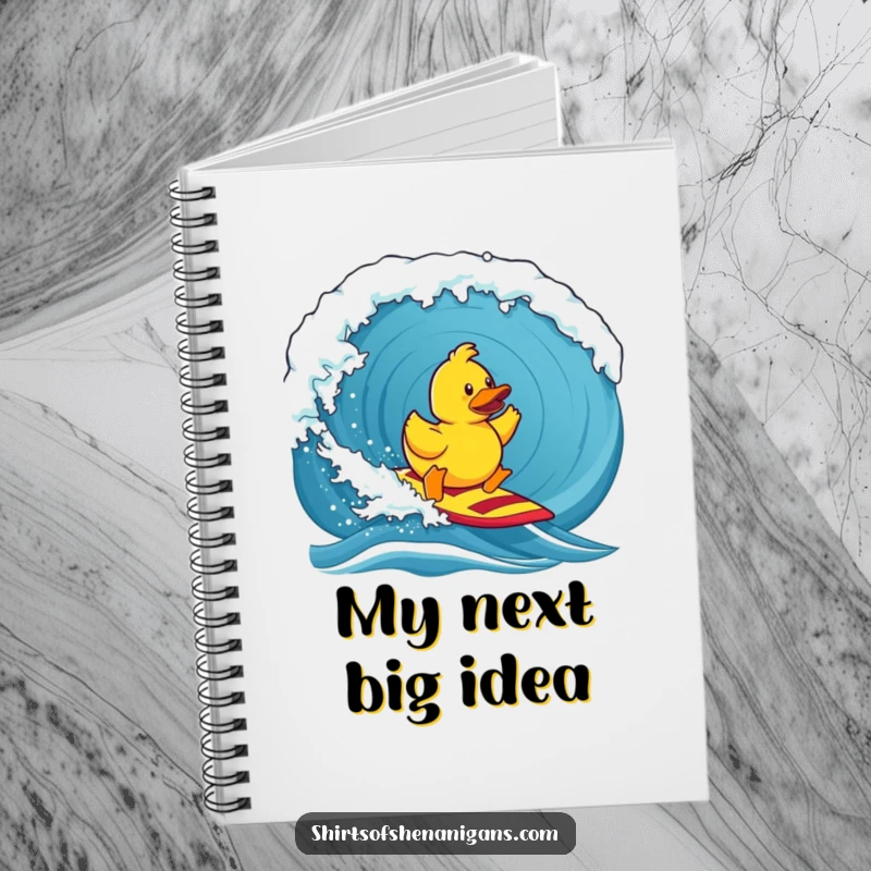 Funny notebook, a determined rubber duck surfing a massive wave, perfect for jotting down humorous ideas.