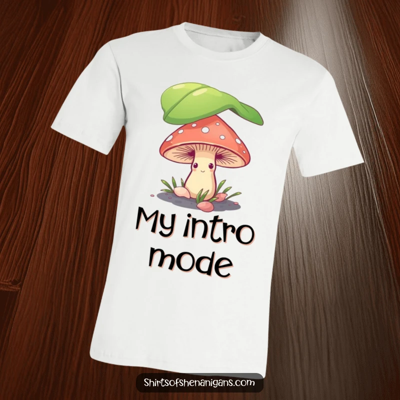 Funny shy mushroom peeking from under a giant leaf on a soft, comfortable t-shirt, conveying introverted humor.