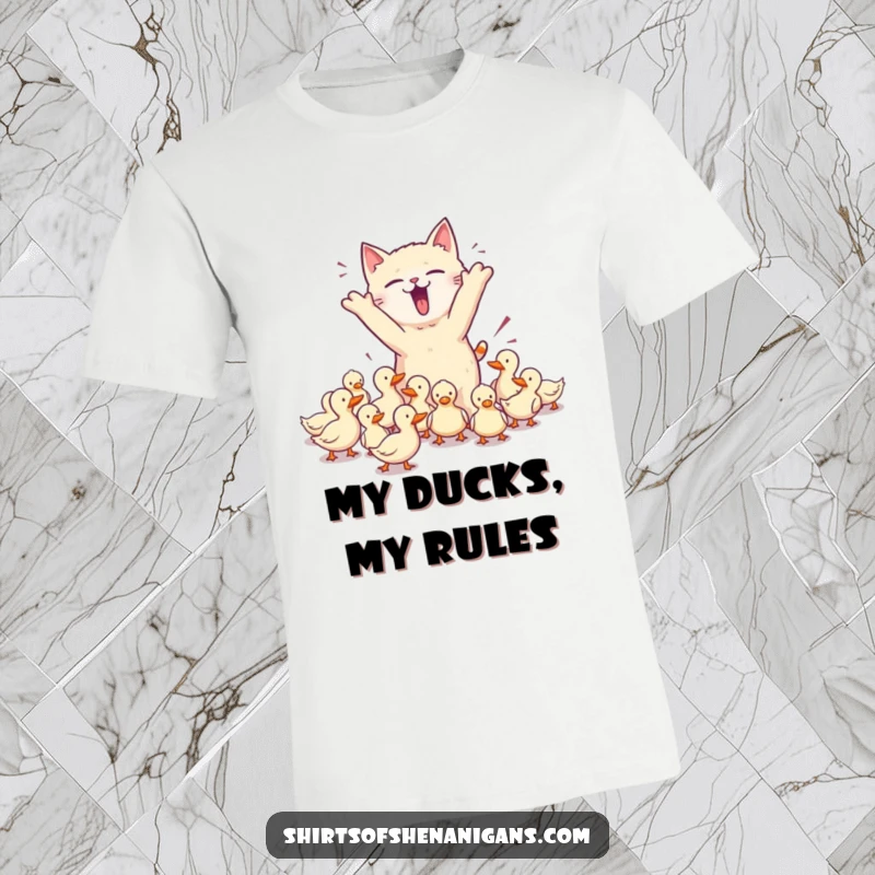 Funny t-shirt depicting a chaotic cat attempting to herd ducks, showcasing pet owner humor and a great funny gift.