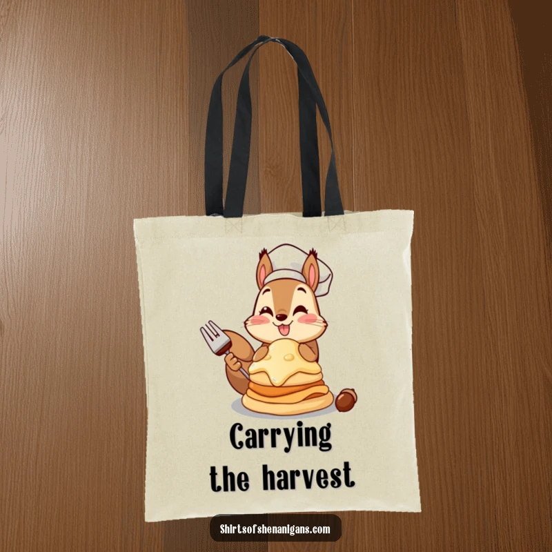 Funny squirrel chef tote bag showcasing a proud squirrel with a giant acorn pancake, ideal for shopping.